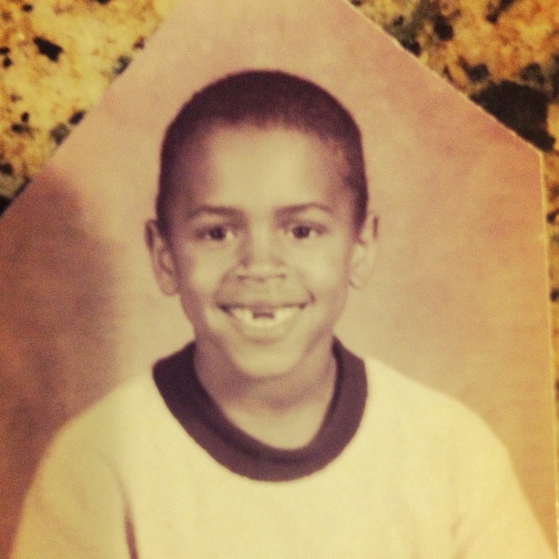 Young Chris smiles, but he’s missing a tooth.