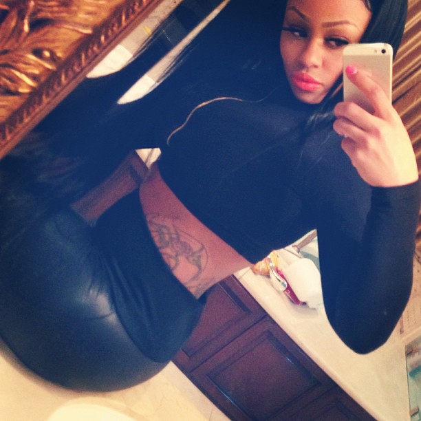 Blac Chyna shows off her booty in black leather.