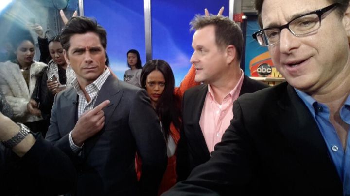 Rihanna flicks it up with the men of the Full House at Good Morning America.