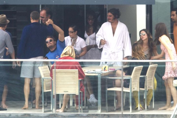 Leo toasts to the good life with Naomi Campbell and friends as they vacation in Italy.
