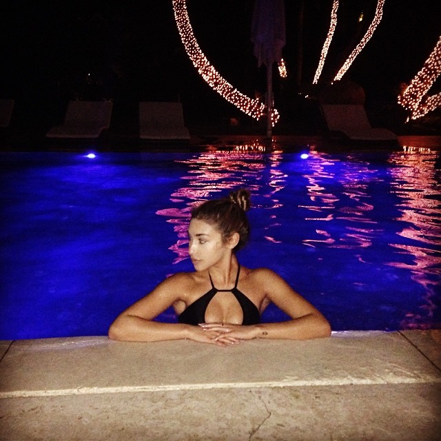 Swimming in the pool at night in Miami.
