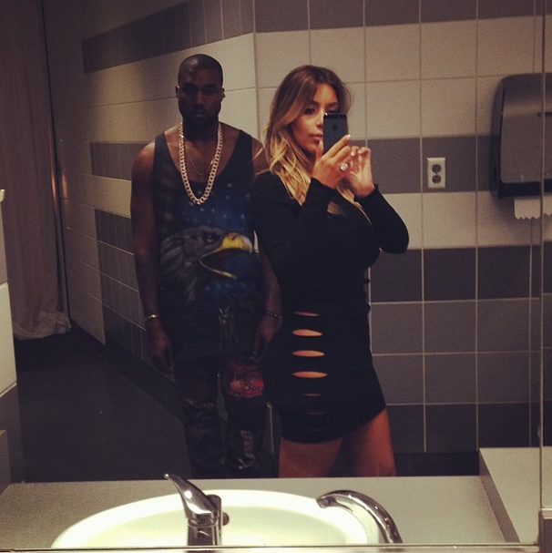 Kim captures a quick selfie with Kanye