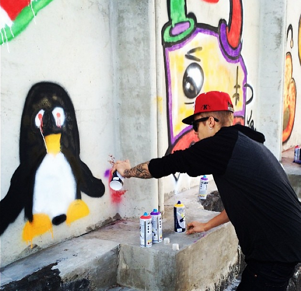 Justin Bieber Grafitting A Wall.