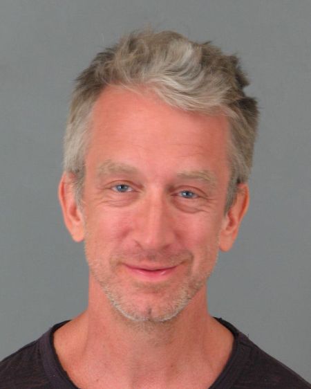 Andy Dick smirks in his mugshot after being arrested at a restaurant in Cali, for allegedly being under the influence.