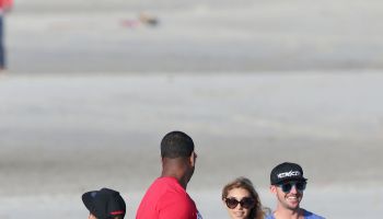 Justin Bieber takes to a Panamanian beach on an ATV watched by Chantel Jeffries