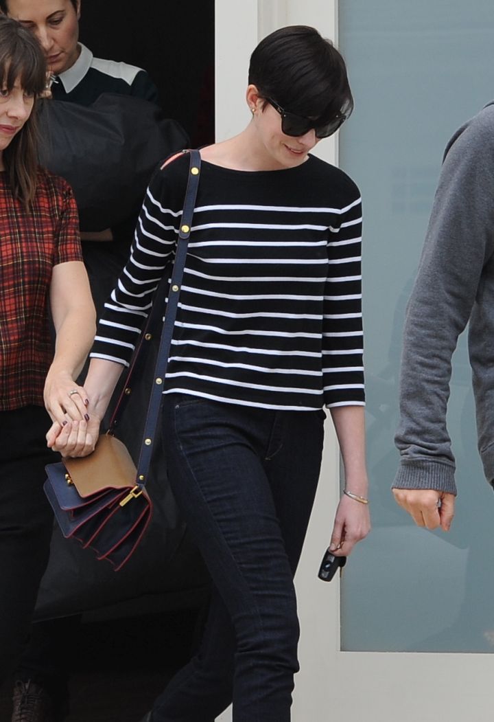 Pretty girl! Anne Hathway was all striped out as she left singing lessons with her head down and stunna shades on.