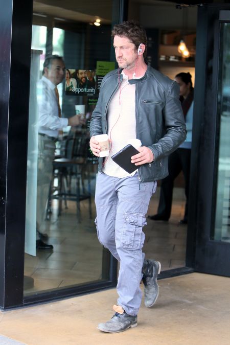 Cup of Joe! Gerard Butler looked handsome in a casual ‘fit as he carried two coffees out of Starbucks.
