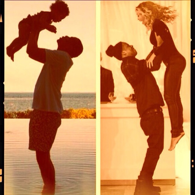 Jay Z lifts his two favorite women in the air.