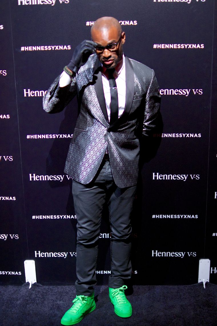 Tyson Beckford killing it with the sneakers and suit combo.