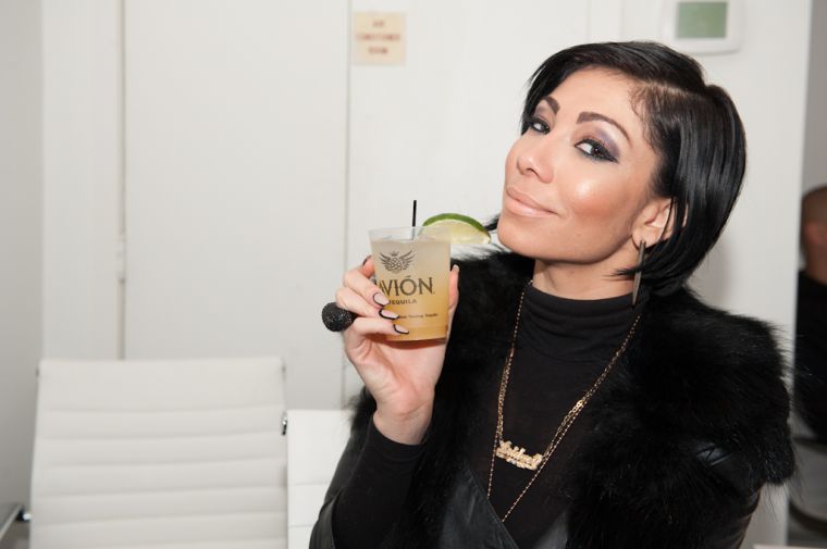 Bridget Kelly sips casually on an Avion drink.