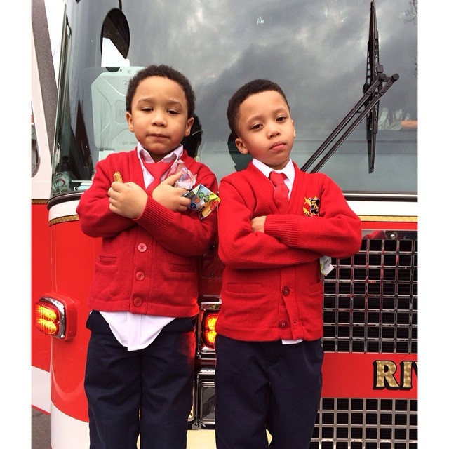 Major and Romelo rocking red ties and posted up on the fire truck.
