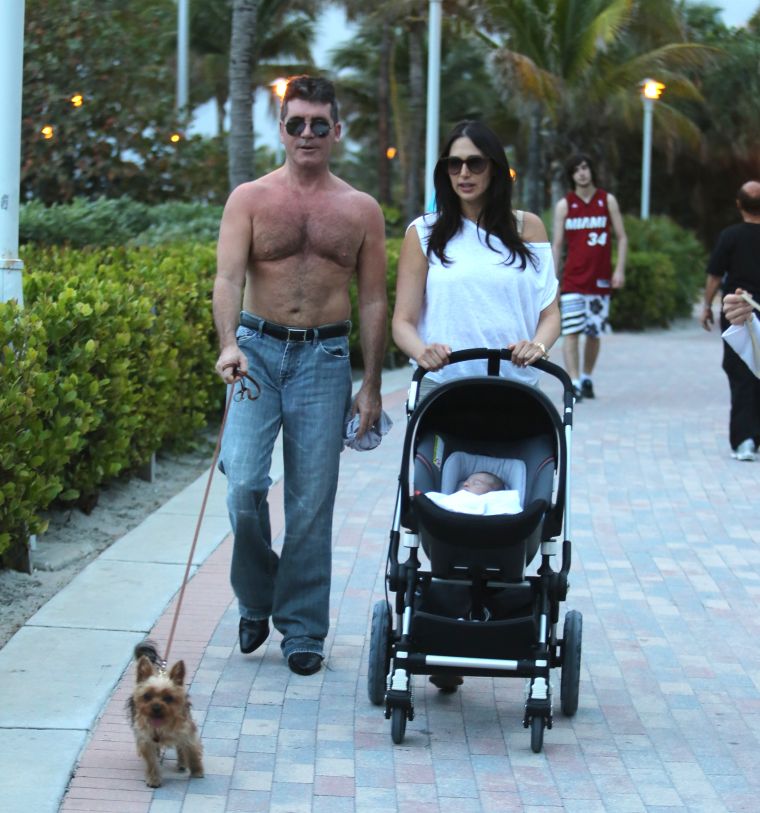 Simon Cowell showed off his post-baby body while hanging out with his son, Eric, and girlfriend, Lauren Silverman.