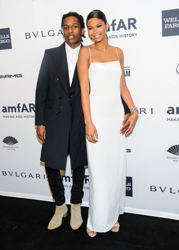 A$AP Rocky and Chanel Iman show off their million dollar smiles at the Mercedes-Benz amfAR Gala in NYC.
