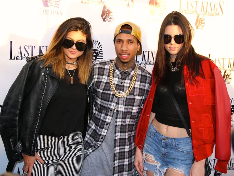 Tyga has the two coolest girls in town on his arm.
