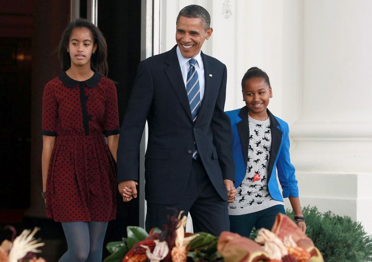 Barack and his girls pardon the National Thanksgiving turkey.