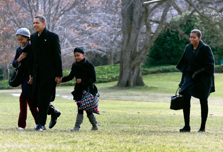 The Obamas in all black everything.