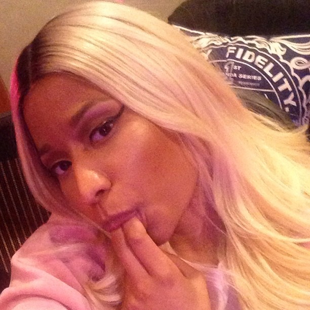 Nicki Minaj with her fingers in her mouth for unknown reasons.