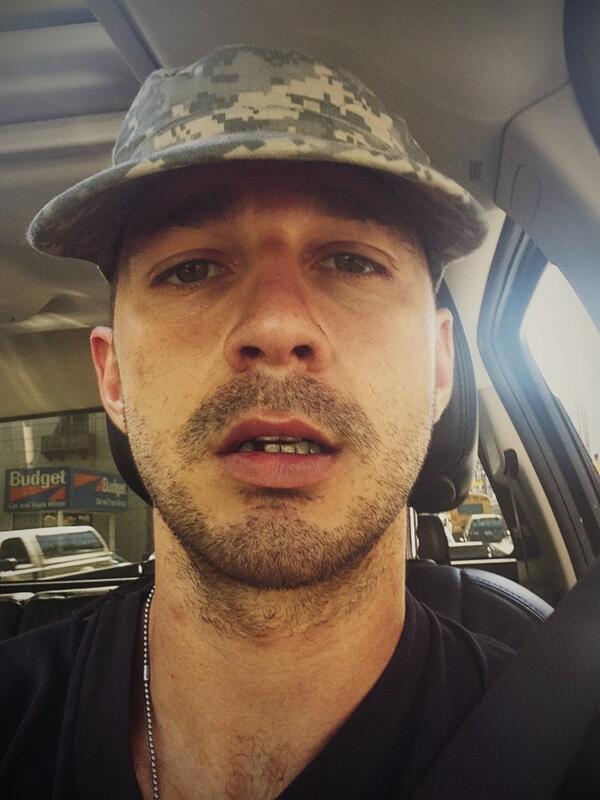 A scruffy Shia LaBeouf and his missing tooth.