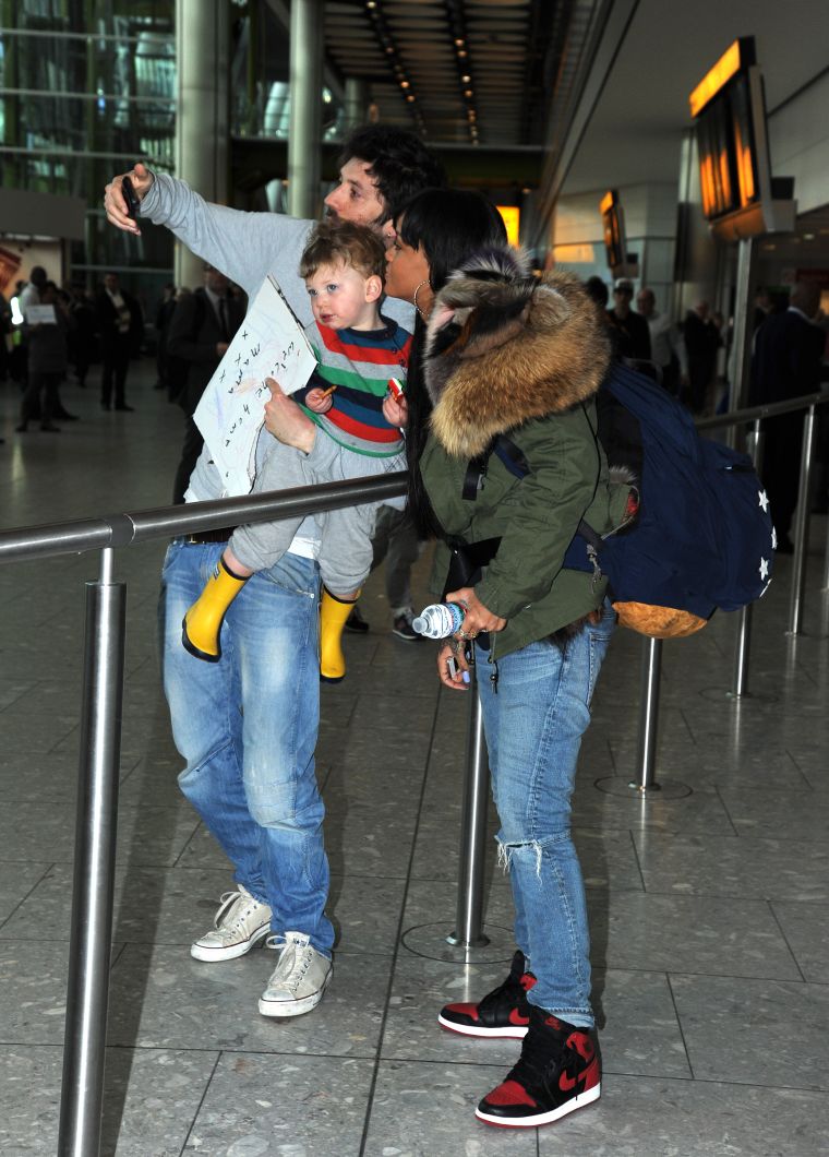 Let me take a selfie! Rihanna flies into Heathrow Airport from Los Angeles.