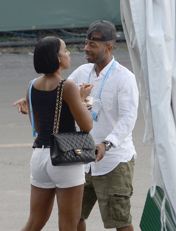 Hug it out! Tim Witherspoon and Kelly Rowland get a quick embrace during the Sony Open at Crandon Park Tennis Center in Key Biscayne, Florida.