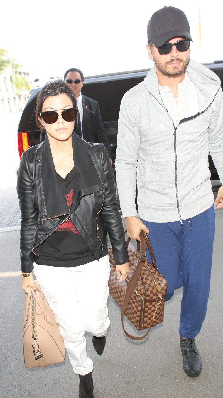 Kourtney Kardashian and Scott Disick at Los Angeles International Airport to board a flight to New York.