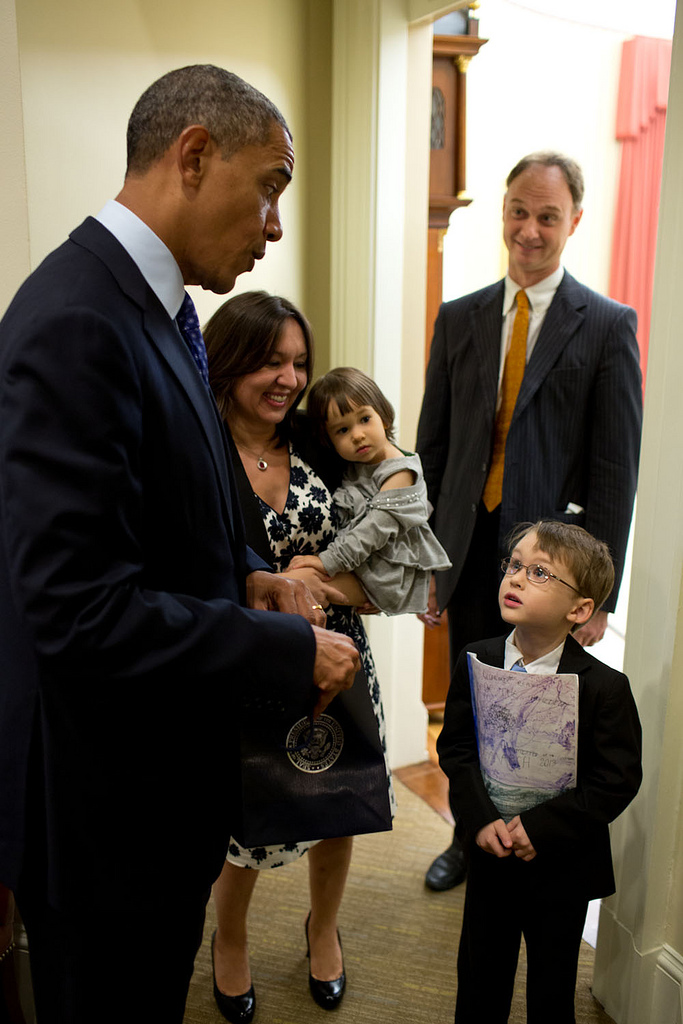 Pete Souza: “The President talks with the six-year-old son of departing staff member David Vandivier just outside the Oval Office. The youngster had just inquired how old the President was going to be in a few days (the President’s birthday is Aug. 4). ’52,’ the President replied. ‘Whoa!’ said the six-year-old.”
