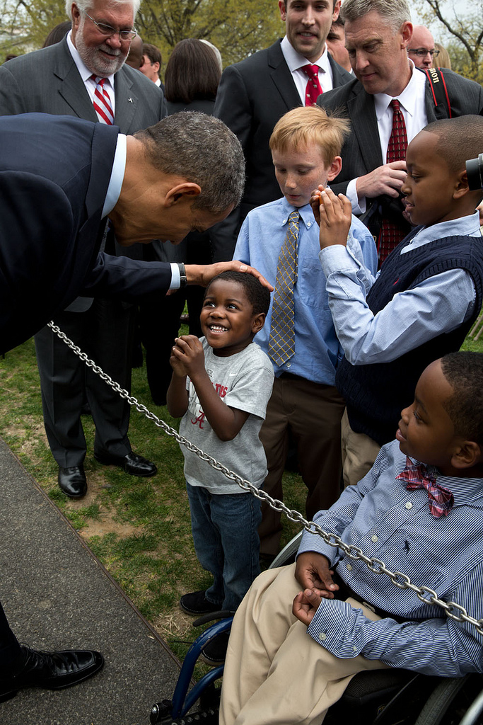 President Obama greets a little boy with the biggest grin we’ve seen in a while.