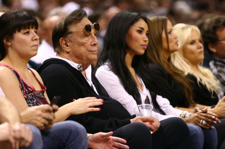 Donald Sterling sitting with his girlfriend at the game. No blacks around them.