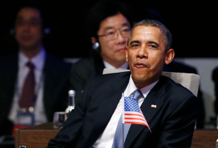 President Obama sneaks in a “We Made It” face during an international meeting.