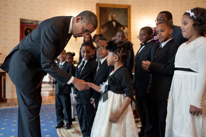Obama greeting little visitors dressed to the nines.