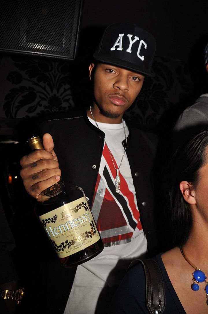 Bow Wow holding a bottle of Hennessy V.S.