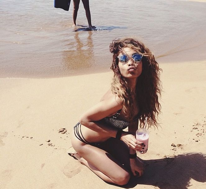 Shayne Murphy blows kisses on the beach