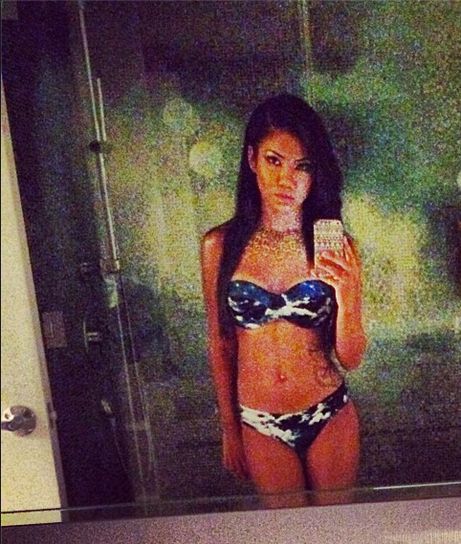 Jhene in a two piece.