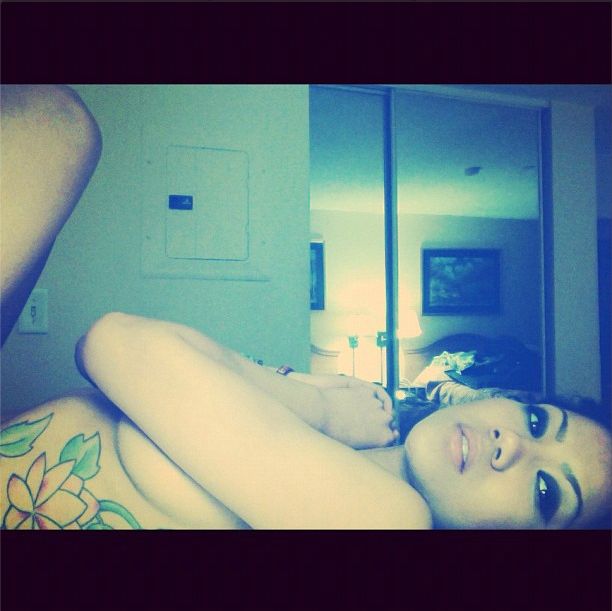 Jhene shows some skin as she chills out.