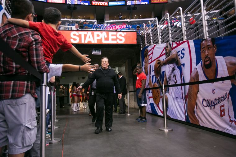 Donald Sterling with a couple of black dudes playing the background.