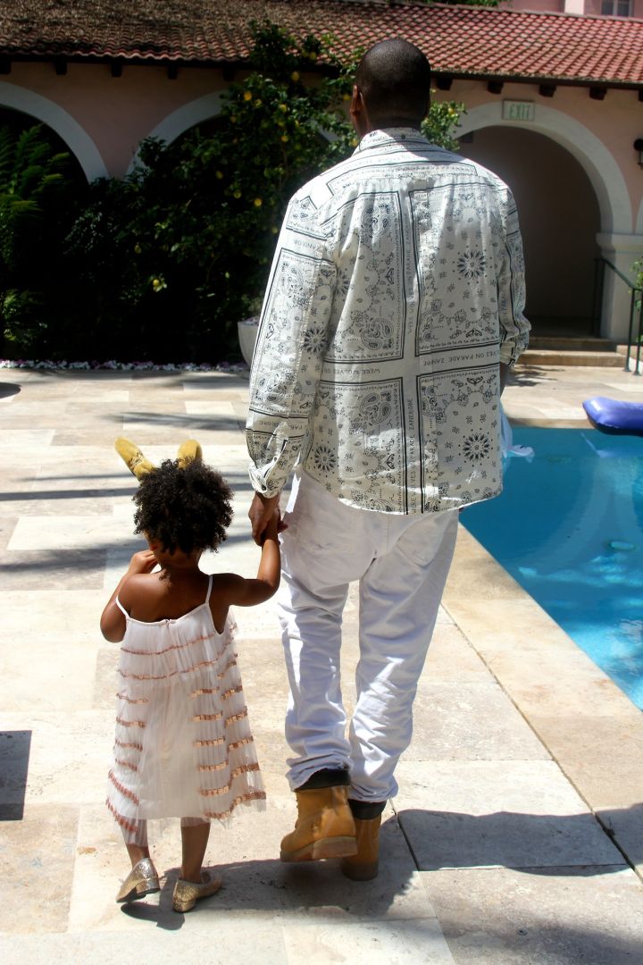 Papa Jay walks hand-in-hand with baby Blue.