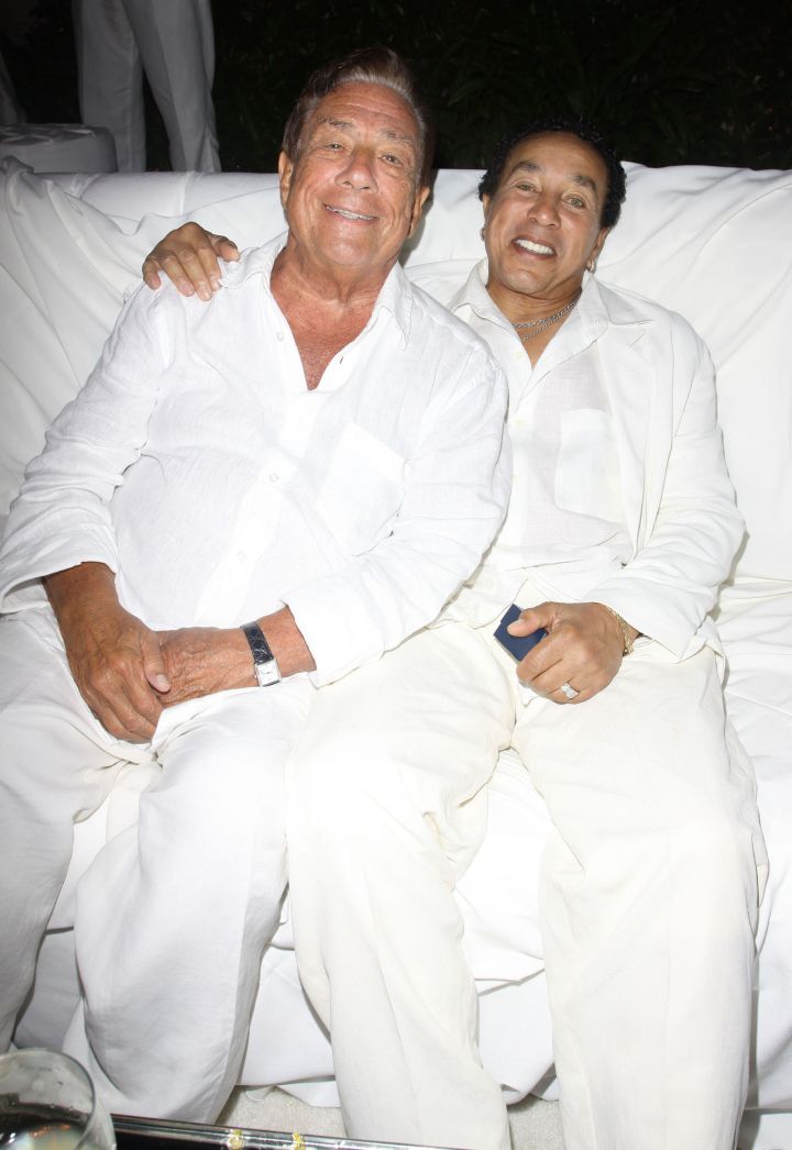 Donald Sterling and Smokey Robinson get close at an all white party for Fred Segal’s birthday party.