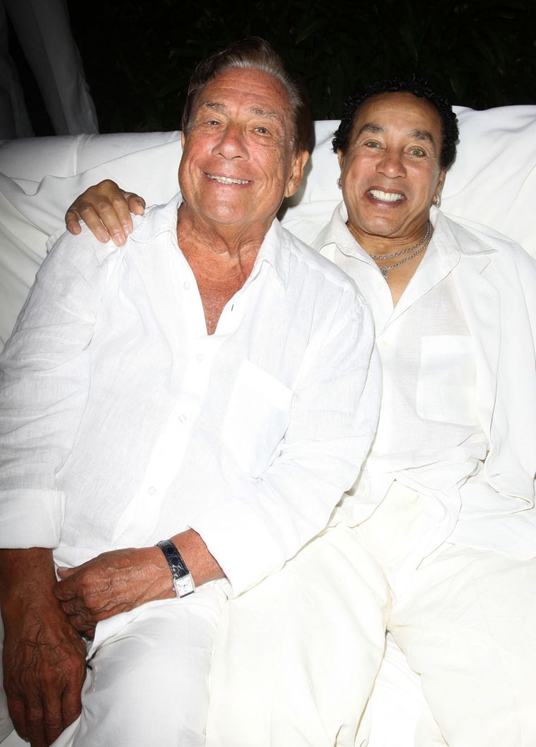 Donald Sterling and Smokey Robinson get close at an all white party for Fred Segal’s birthday party.