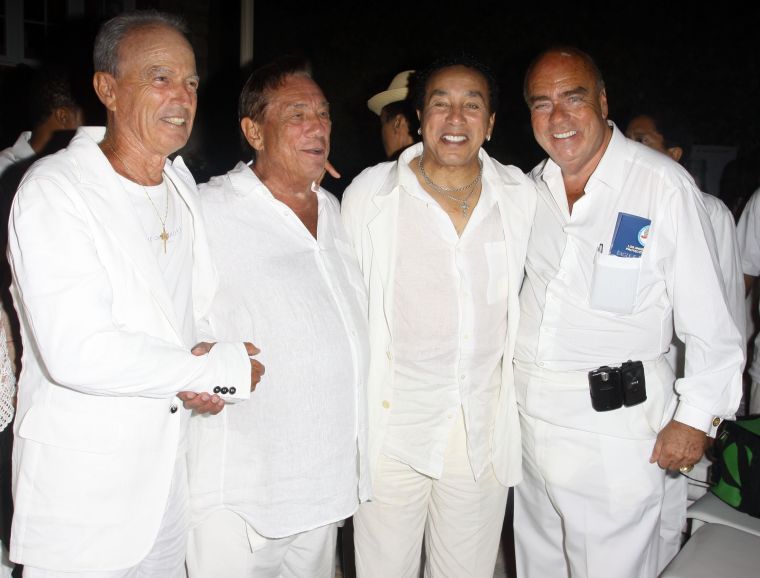 Donald Sterling and Smokey Robinson hang out with friends at an all white party.