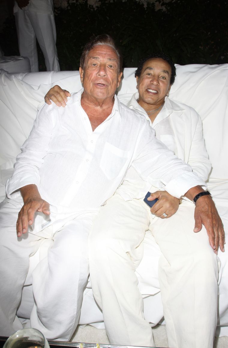 Donald Sterling and Smokey Robinson get close at an all white party.
