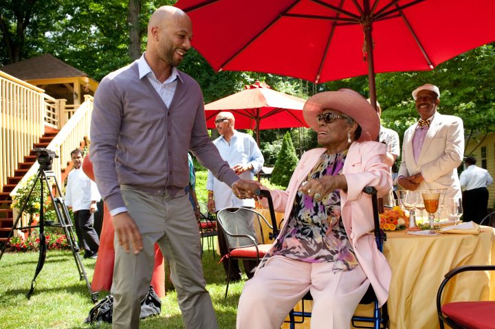 Maya Angelou pictured with rapper Common at her 82nd birthday. Common has been vocal about her influence, releasing “The Dreamer” in 2011 featuring the poet.