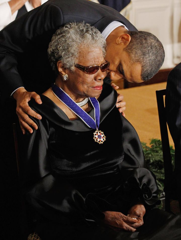 President Barack Obama kisses poet and author Maya Angelou after giving her the 2010 Medal of Freedom.