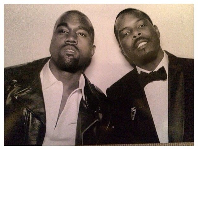 Kanye poses it up with Tracey Mills at the wedding reception