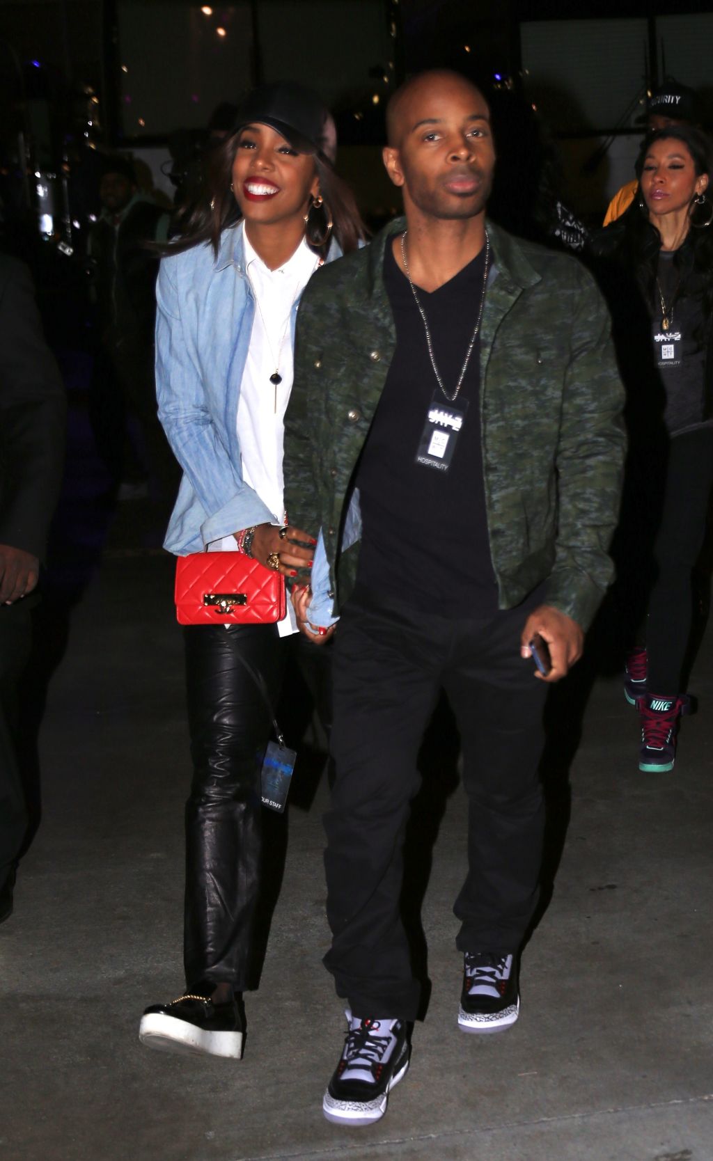 Kelly Rowland Tim Witherspoon holding hands
