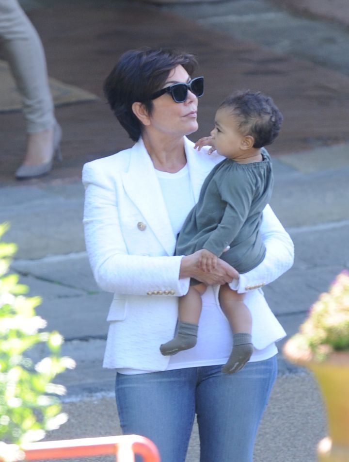 Kris Jenner carries North West out of their Florence Hotel