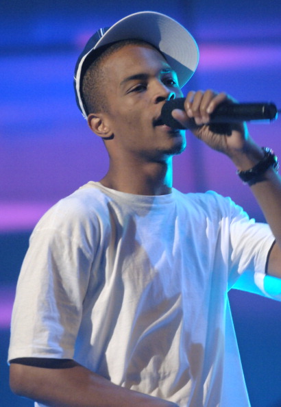 T.I. performing on stage.