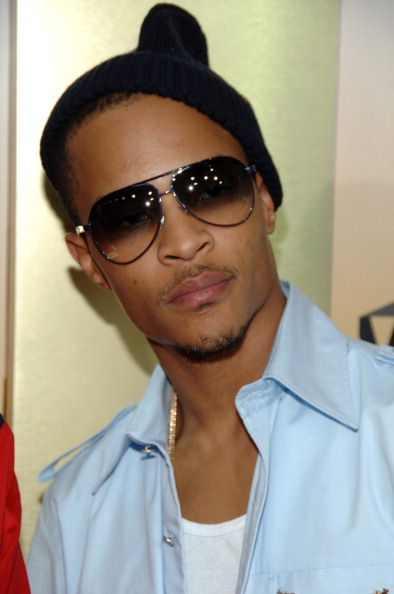 T.I. posed in a beanie to the side.