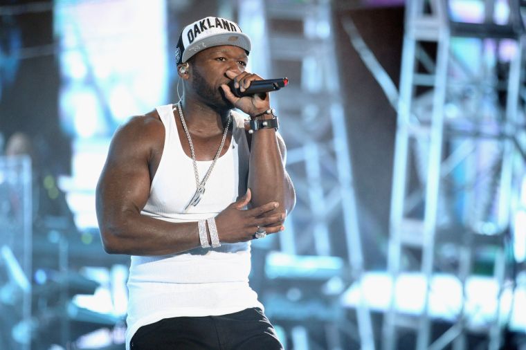 50 Cent shows off muscles.