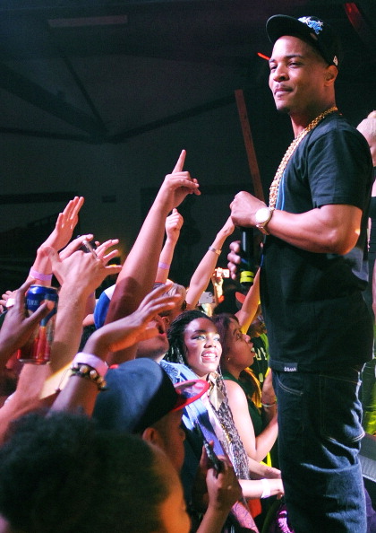 T.I. performing for a crowd.