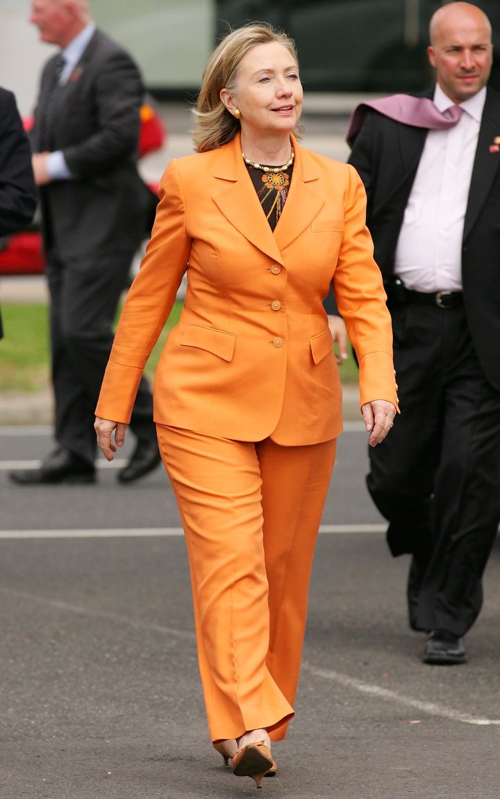 November 2012: Hillary knows what colors work for her. This orange number is it!